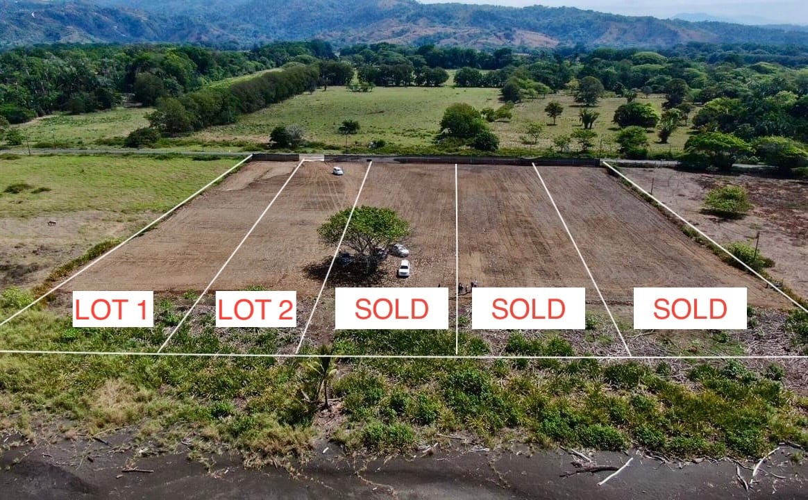 Drone view of the beachfront lots at Hermosa Real, with Lots 1 and 2 available
